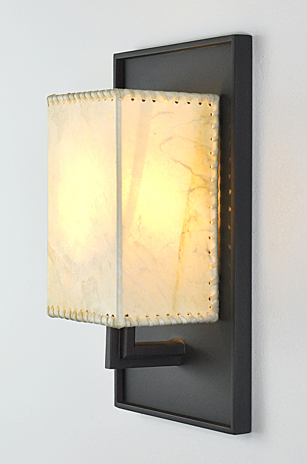 iron and rawhide sconce
