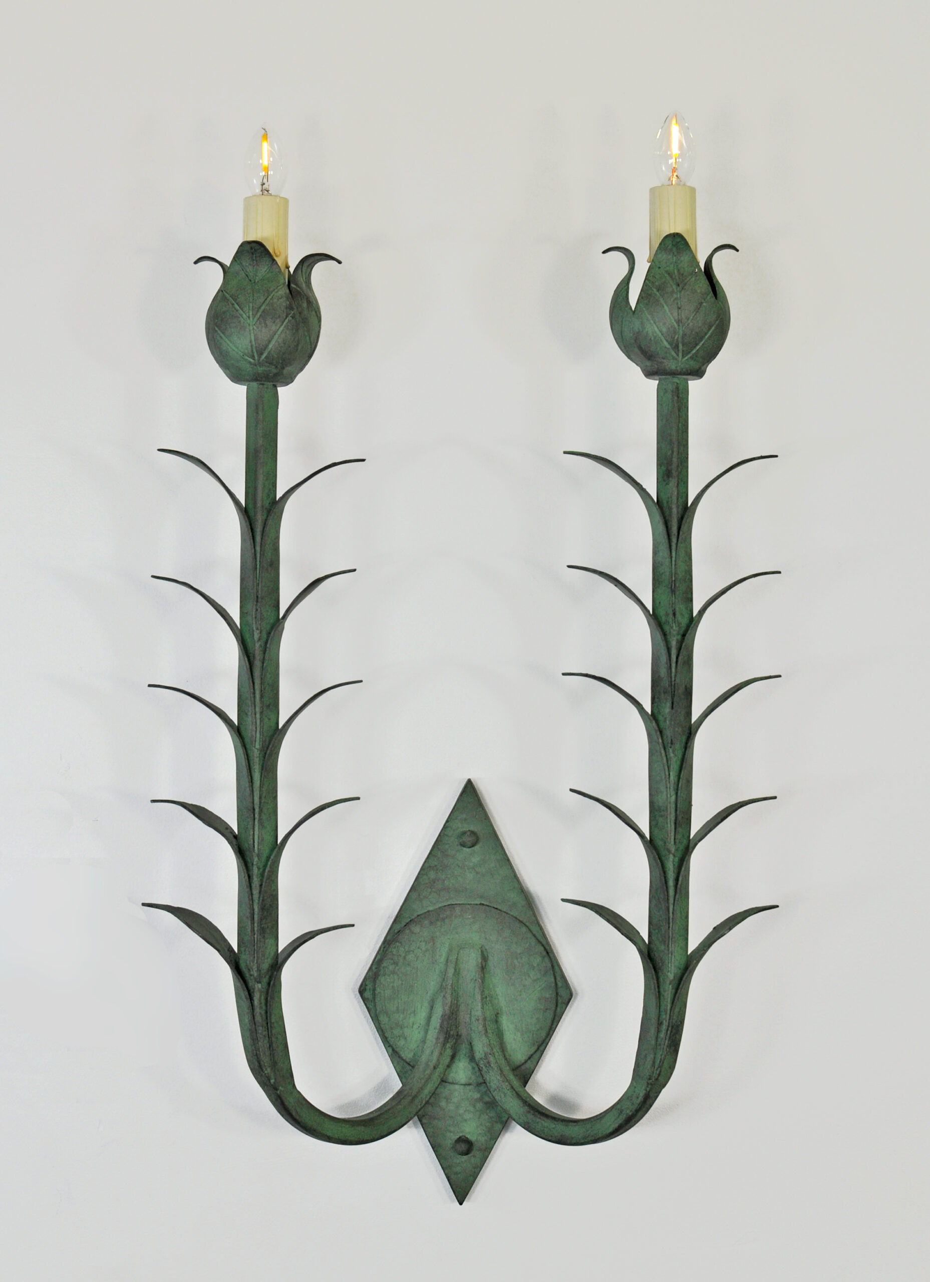 2-light verdigris sconce with leaf motif